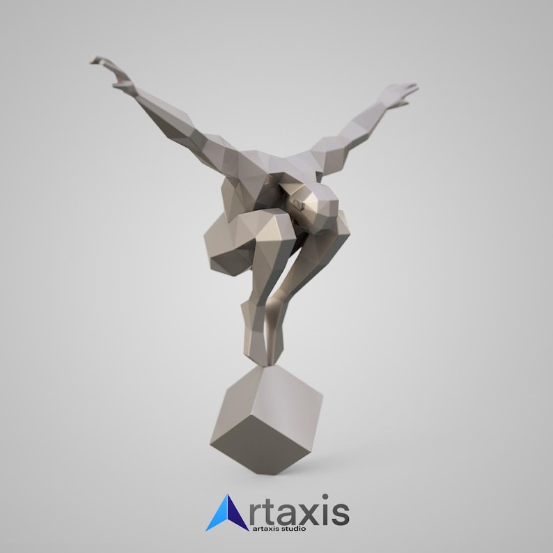 May include: A geometric, abstract sculpture of a person in a crouching pose with arms outstretched, standing on a cube. The sculpture is made of a light gray material.