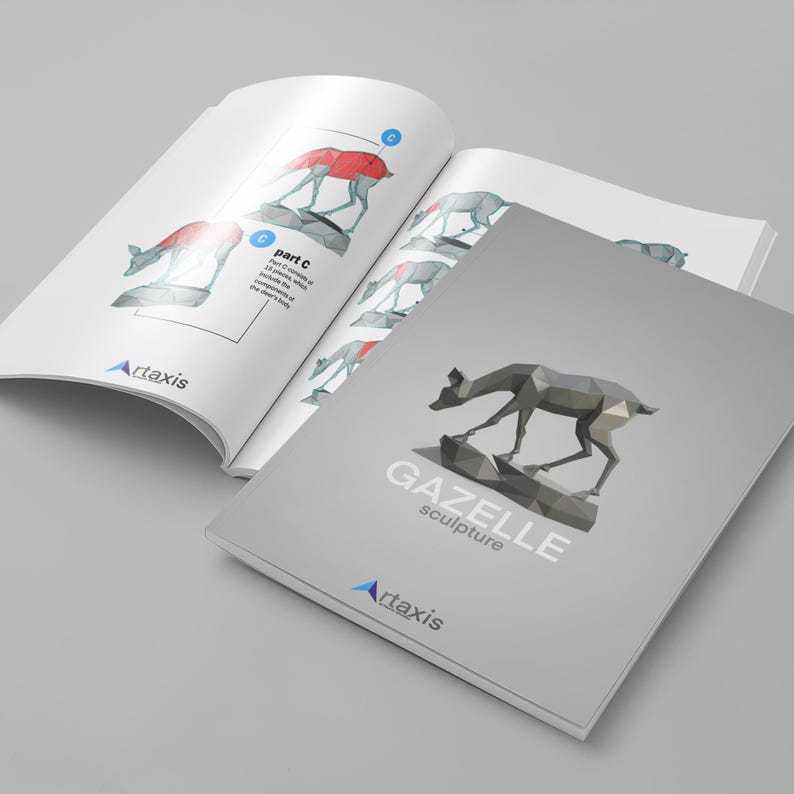 May include: A gray and white paper booklet with the title "GAZELLE sculpture" and the logo "Artaxis" on the cover. The booklet is open to a page with a diagram of a gazelle sculpture, showing the different parts of the sculpture.