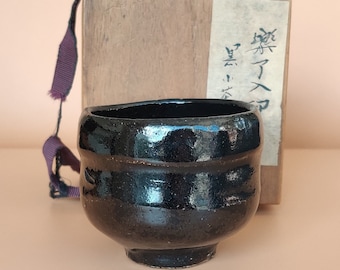 Black raku sake bowl by Kichizaemon IX (Ryonuyo) (1756-1834) with box