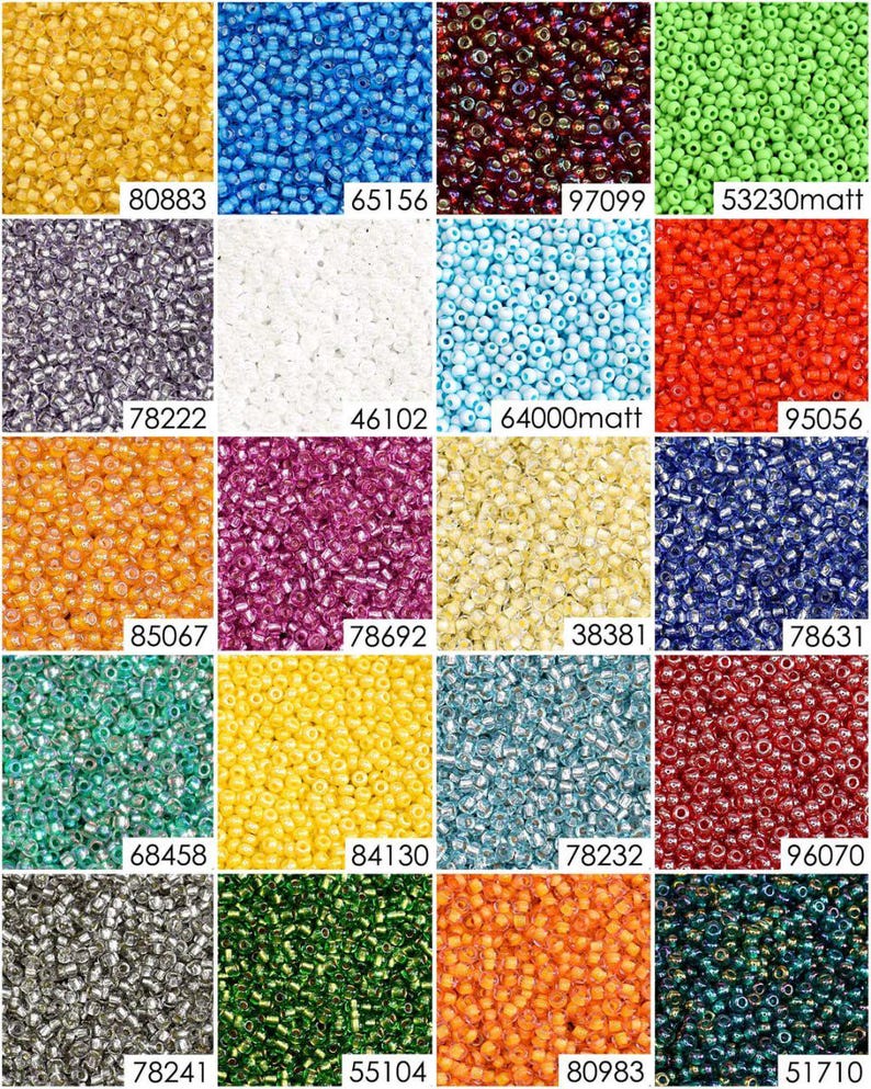 May include: Assortment of 12 small glass seed beads in various colors, including gold, blue, red, green, purple, white, and orange. The beads are arranged in a grid pattern.
