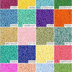 May include: A collection of 16 different colors of seed beads, each color displayed in a square. The beads are small and round, and they are arranged in a grid pattern. The colors include pink, blue, green, yellow, orange, red, and purple.
