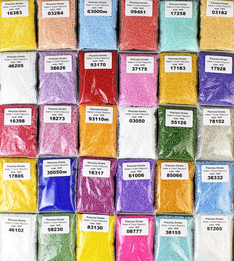 May include: Assortment of small, round, colorful beads in individual plastic bags. Each bag has a label with the brand name "Preciosa Ornela", the size of the beads, and a code number.