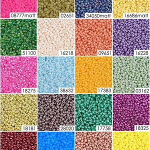 May include: Assortment of 20 different colors of seed beads. The beads are small and round, and they are arranged in a grid pattern. The colors include pink, green, white, orange, purple, blue, yellow, gold, brown, and red.