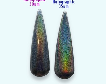 May include: Two samples of holographic nail glitter, one labeled "Holographic 30um" and the other "Platinum Holographic 35um". The samples are shown at a light angle, revealing a rainbow of colors.