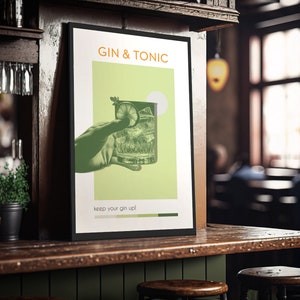A green color Gin Tonic poster, carrying a vintage vibe, with an image of a hand holding a cocktail glass, stands leaning against the bar of a pub, cocktail glasses are hung next to it and the bar has a wooden texture.