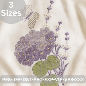 May include: Embroidered floral design featuring a butterfly and lavender-like flowers in shades of purple, green, and white on a cream-colored fabric. The text "3 Sizes" is in a gray circle. The bottom of the image has the text "PES-JEF-DST-PEC-EXP-VIP-VP3-XXX".