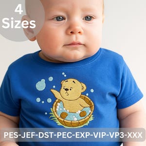 May include: A blue baby t-shirt featuring an embroidered design of a teddy bear in a wooden tub with bubbles. The text "4 Sizes" is in a white circle in the upper left. The bottom of the shirt has the text "PES-JEF-DST-PEC-EXP-VIP-VP3-XXX".