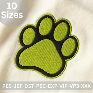 Puede incluir: Parche bordado con huella de pata en verde lima con contorno negro. El parche está sobre una tela color crema. La imagen incluye el texto "10 Tamaños" en un círculo blanco y códigos de tipo de archivo.