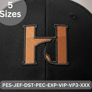 May include: Black baseball cap featuring an embroidered orange letter "H" and a curved design. The cap has the text "5 Sizes" in a white circle. The bottom of the cap has the text "PES-JEF-DST-PEC-EXP-VIP-VP3-XXX".