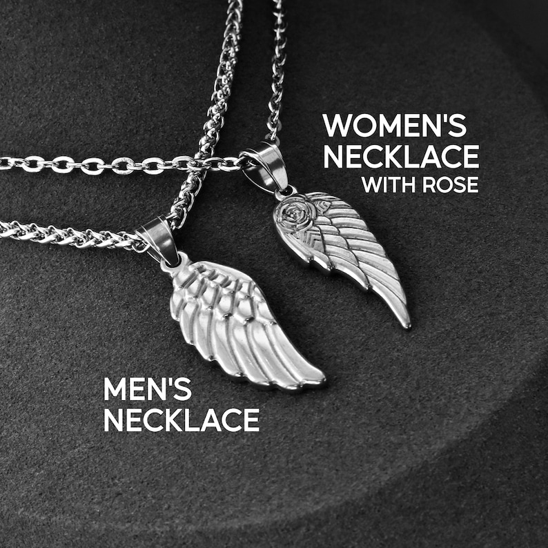 May include: Two silver-colored necklaces with wing pendants. One pendant has a rose design. The text on the image reads "MEN'S NECKLACE" and "WOMEN'S NECKLACE WITH ROSE". The necklaces are on a dark gray background.