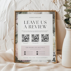 Può includere: Un cartello rettangolare con cornice dorata, sfondo floreale e pannello centrale bianco. Il testo recita LEAVE US A REVIEW, include tre codici QR per Google, Facebook e Yelp, e sezioni per i social media. In basso è scritto THANK YOU FOR YOUR SUPPORT.