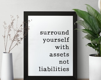 May include: Black framed print with the text "surround yourself with assets not liabilities" on a white background.