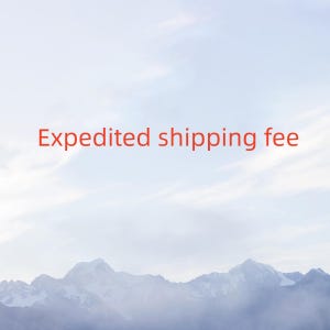 May include: A photograph of a cloudy sky with mountains in the distance. The text "Expedited shipping fee" is displayed in red across the sky.