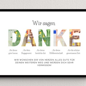 Abschiedsgeschenk für eine Kollegin in einem schwarzen Bilderrahmen an einer Wand