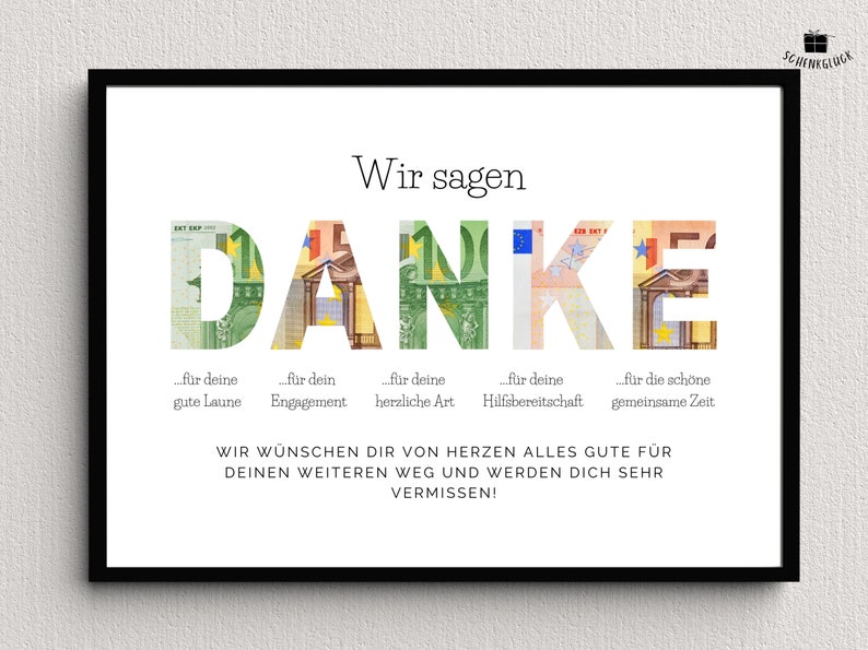 Abschiedsgeschenk für eine Kollegin in einem schwarzen Bilderrahmen an einer Wand