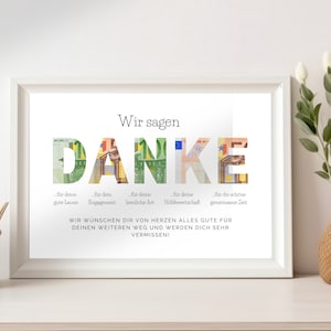 Abschiedsgeschenk Kollegin in weißem Holzbilderrahmen zwischen Dekoelementen