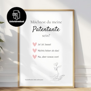 Puede incluir: Un cartel enmarcado con texto en alemán que pregunta "Möchtest du meine Patentante sein?" (¿Quieres ser mi madrina?). El cartel incluye casillas de verificación con opciones y un dibujo lineal de una mano sosteniendo una flor.