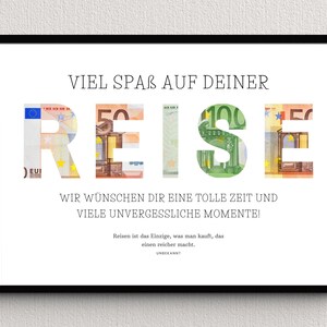 Geldgeschenk Reisekasse in einem schwarzen Bilderrahmen hängt an einer Wand