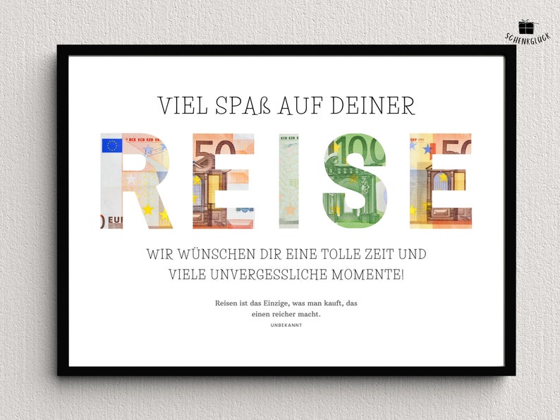 Geldgeschenk Reisekasse in einem schwarzen Bilderrahmen hängt an einer Wand