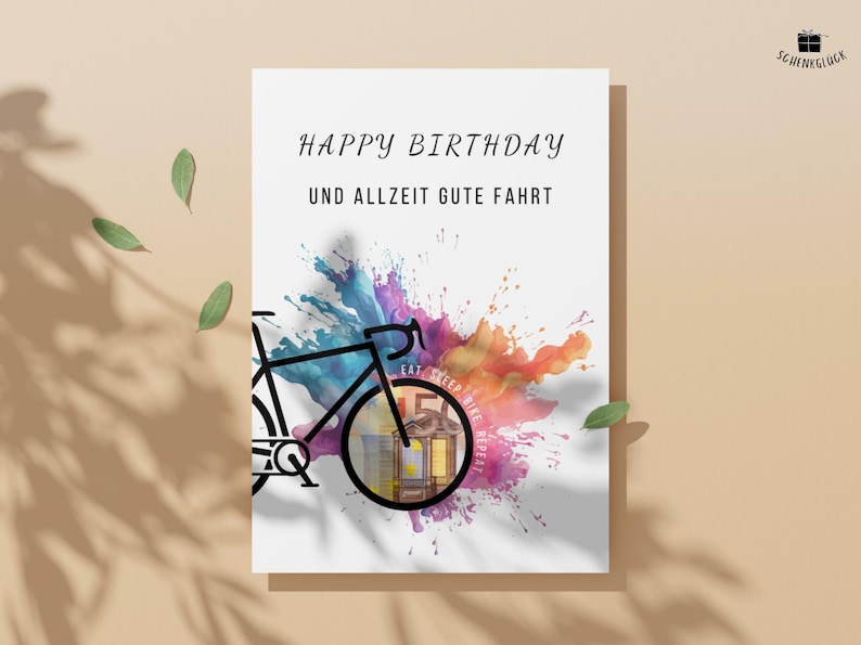 Geldgeschenk Fahrrad Geburtstag vor einem orangenen Hintergrund mit grünen Blättern