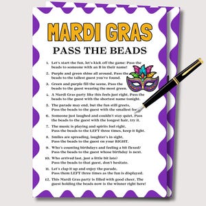 May include: A party game card for Mardi Gras, with a purple and white wavy border. The card displays the text "MARDI GRAS PASS THE BEADS" in yellow and black. A decorative mask and a black pen are also visible.
