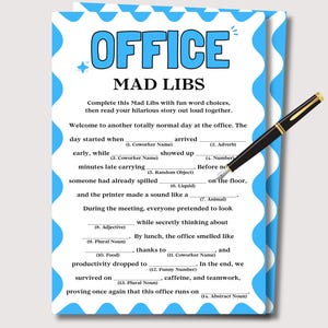May include: A white paper sheet with a blue scalloped border featuring the text OFFICE MAD LIBS and a fill-in-the-blank story about office life. A black and gold fountain pen rests diagonally across the paper, which includes fourteen numbered prompts.
