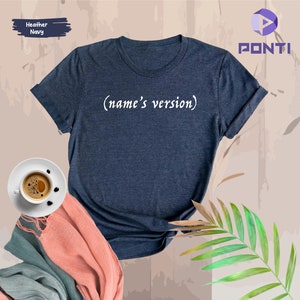 May include: A heather navy blue t-shirt with the text "(name's version)" printed in white on the front.