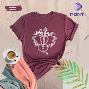 May include: Heather maroon t-shirt featuring a white design of a violin inside a heart shape made of musical notes.