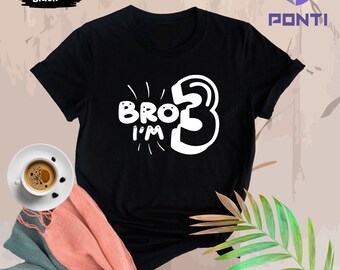 May include: Black t-shirt with white text that says "Bro I'm 3".