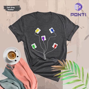 May include: Dark gray heather t-shirt featuring a graphic of five colorful squares connected by gray lines. Each square has a different color: yellow, blue, purple, green, and red. The shirt has the word "PONTI" printed on the upper right.