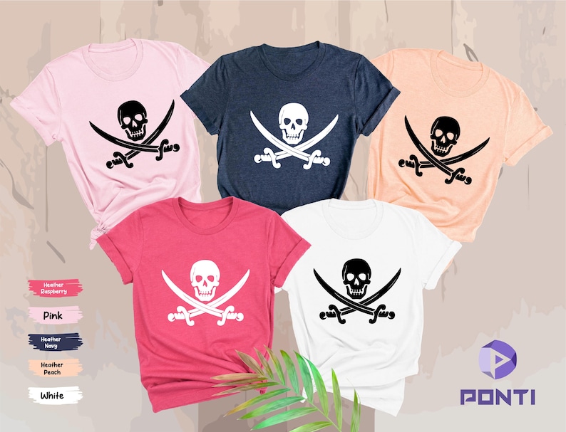 May include: Five short-sleeved t-shirts in various colors: pink, navy, peach, white, and red. Each shirt features a black skull and crossbones graphic. The shirts are displayed on a neutral background.