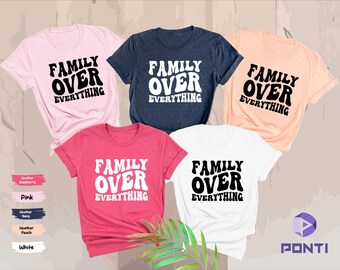 May include: Five t-shirts in different colors with the text "Family Over Everything" in a retro font. The shirts are pink, white, navy blue, peach, and red.