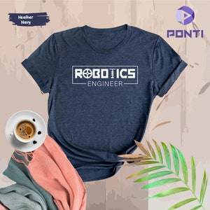 May include: A heather navy blue t-shirt with a white graphic that says "Robotics Engineer" with a gear symbol.