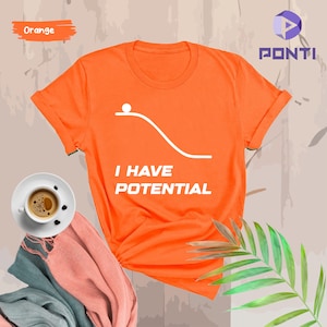 May include: Orange t-shirt with a white graphic of a ball rolling down a hill and the text "I HAVE POTENTIAL".