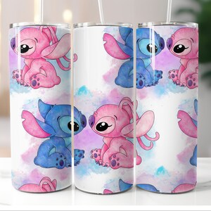 May include: Three stainless steel tumblers with a white background and a watercolor design of blue and pink Stitch characters. The characters are in various poses, including hugging and looking at each other.