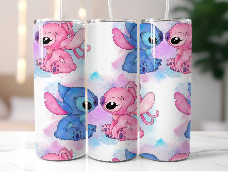 May include: Three stainless steel tumblers with a white background and a watercolor design of blue and pink Stitch characters. The characters are in various poses, including hugging and looking at each other.