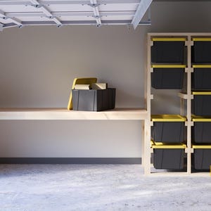 May include: A wooden shelf unit with black storage bins. The shelf unit is in a garage setting with a wooden workbench in front of it.