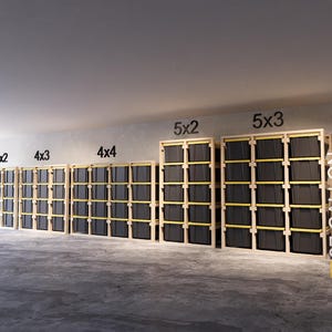 May include: A series of wooden storage units with black bins. The units are labeled 4x2, 4x3, 4x4, 5x2, and 5x3. The image also includes the text "27 GALLON".