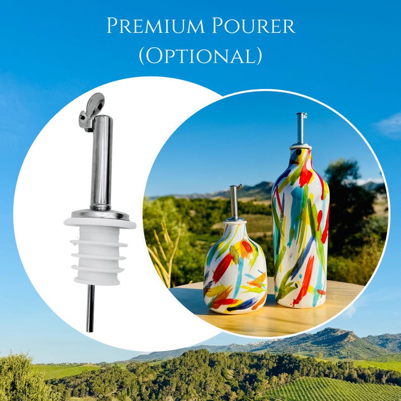 May include: A silver metal pourer with a white silicone stopper and two ceramic bottles featuring a multi-coloured paint stroke pattern. The text "PREMIUM POURER (OPTIONAL)" is displayed above the items, which are set against a blue sky.