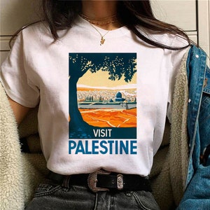 Kurzärmeliges Baumwoll-T-Shirt Zeigen Sie Ihre Unterstützung mit unseren geschlechtsneutralen T-Shirts Committed to Palestine. Bild 4