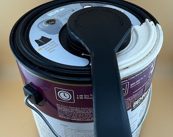 Herramienta para quitar tapas de latas de pintura BEHR