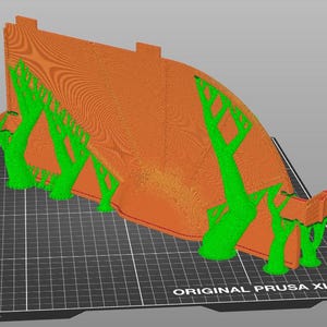 May include: A 3D-printed model featuring a large, curved orange structure with a textured surface, supported by several bright green tree-like structures. The model sits on a black grid, with "ORIGINAL PRUSA XL" text.