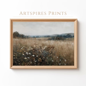 May include: A framed print of a landscape with a field of tall, dry grass and wildflowers under a cloudy sky. The artwork has a muted colour palette of browns, greens, and whites. The text "ARTSPIRES PRINTS" is at the top.