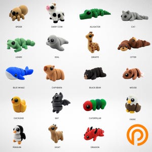May include: A collection of twenty small animal-shaped erasers arranged in a grid. The figures include a spider, cow, alligator, cat, lizard, seal, giraffe, otter, whale, capybara, bear, mouse, duckling, bat, caterpillar, eagle, penguin, goat, and dragon.