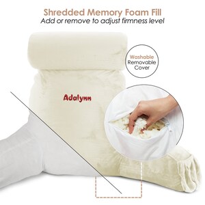 May include: A white, plush, wedge-shaped pillow with a removable cover. The pillow is filled with shredded memory foam that can be adjusted to change the firmness level. The pillow has the word "Adalynn" embroidered on it.