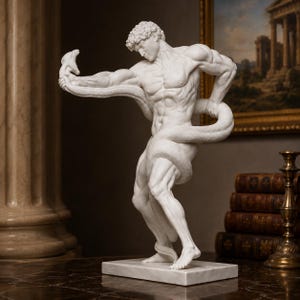 May include: A white marble-style sculpture depicting a muscular figure in a dynamic pose, entwined by a large snake. The figure stands on a rectangular base, showcasing detailed anatomical features and a smooth, matte finish throughout the piece.