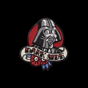 May include: An embroidered patch featuring a gray and black helmeted character head centered over a red circular background. A white banner across the bottom contains the black text DARK SIDE, accented by two red flowers with blue leaves.
