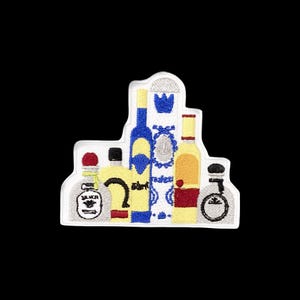 May include: An embroidered patch featuring a collection of five liquor bottles in various shapes and sizes. The design includes a silver bottle, a yellow bottle, a tall blue bottle, a white bottle with blue patterns, and a gold bottle with red accents.
