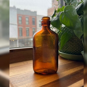 Vintage Half Pint Whiskey Flask Amber Glass Seaworn Bottle