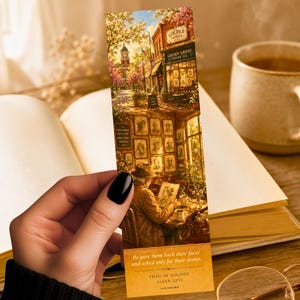 May include: A bookmark featuring a detailed illustration of a coffee shop scene with the text "GOLDEN GROVE COFFEE CO." and a quote by Allen Levi. The bookmark is held over an open book, with a coffee cup in the background.